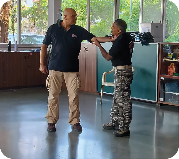 Close-up of instructor showing hand-grab escape technique